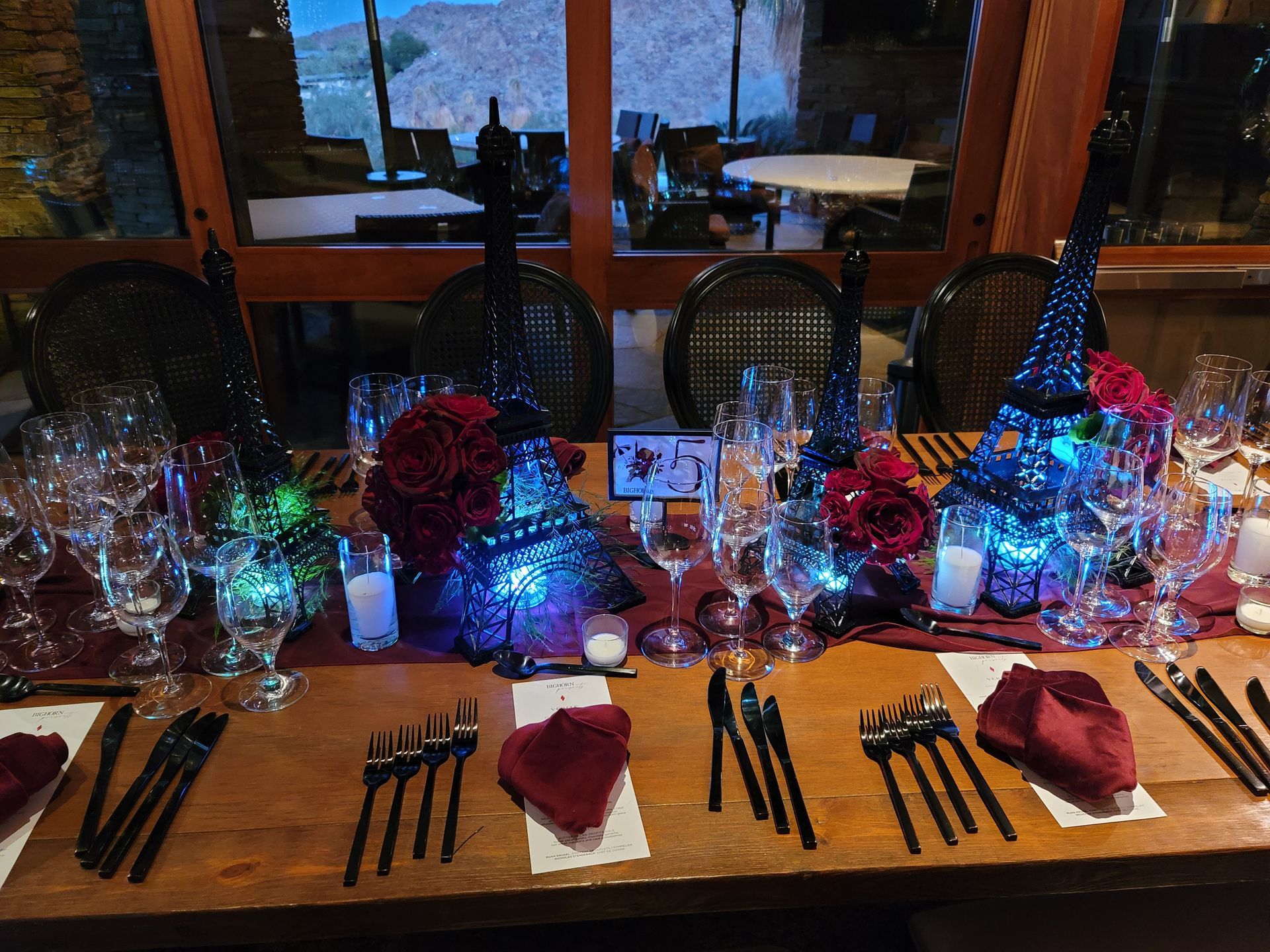 A table with a lot of glasses and utensils on it