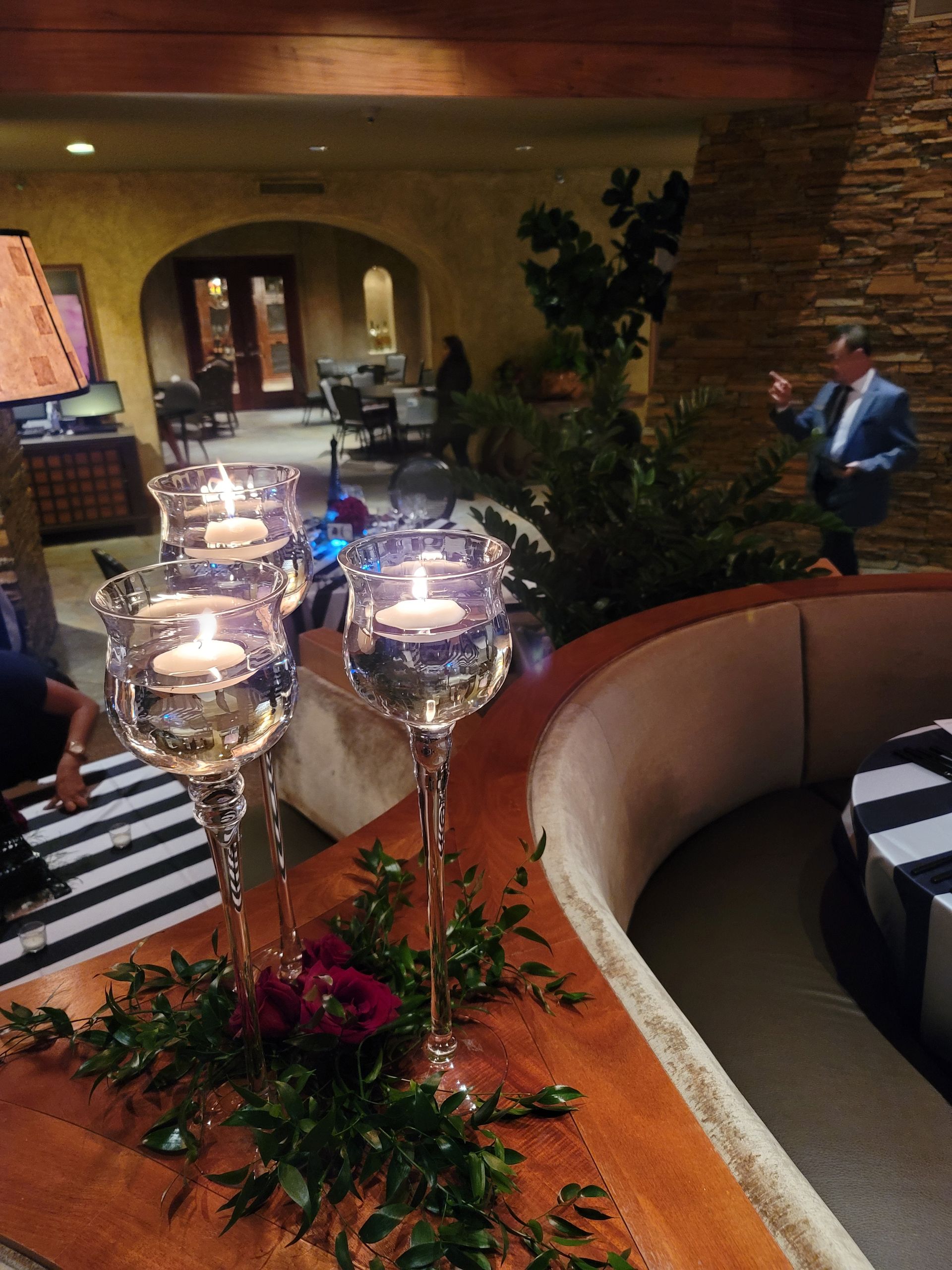 A group of candles are sitting on a table in a room