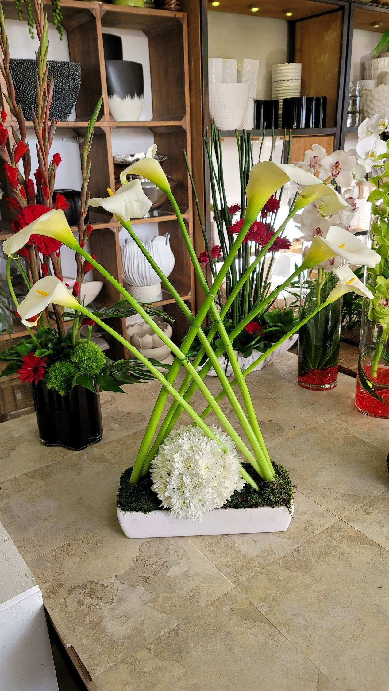 A vase filled with flowers is sitting on a table.