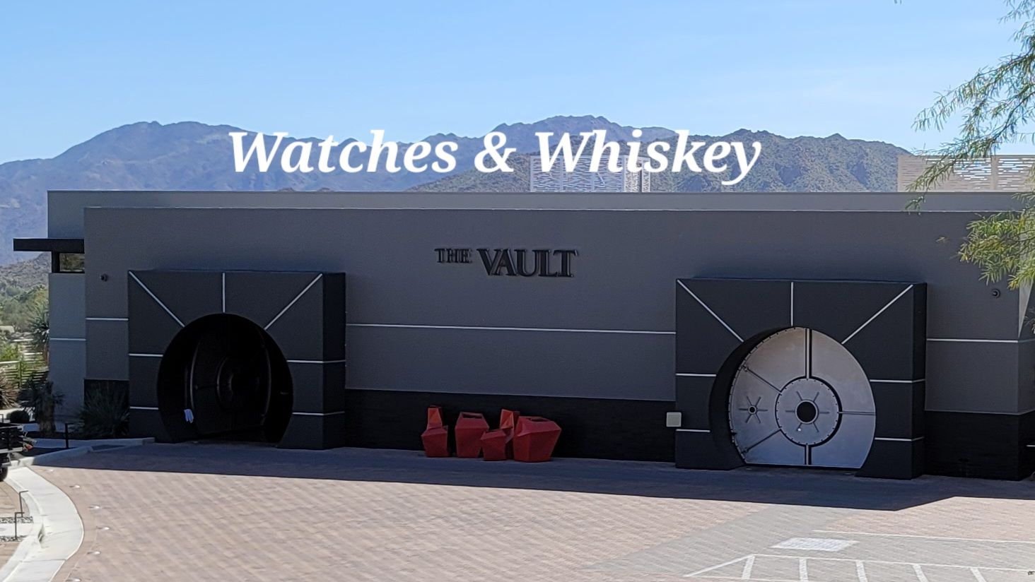 A building that says watches and whiskey on it