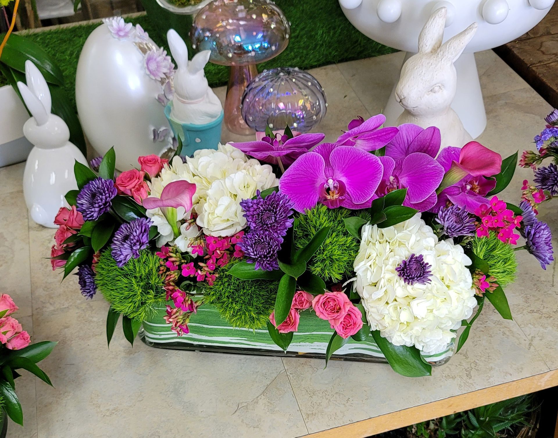 A bunch of flowers are sitting on top of a table.