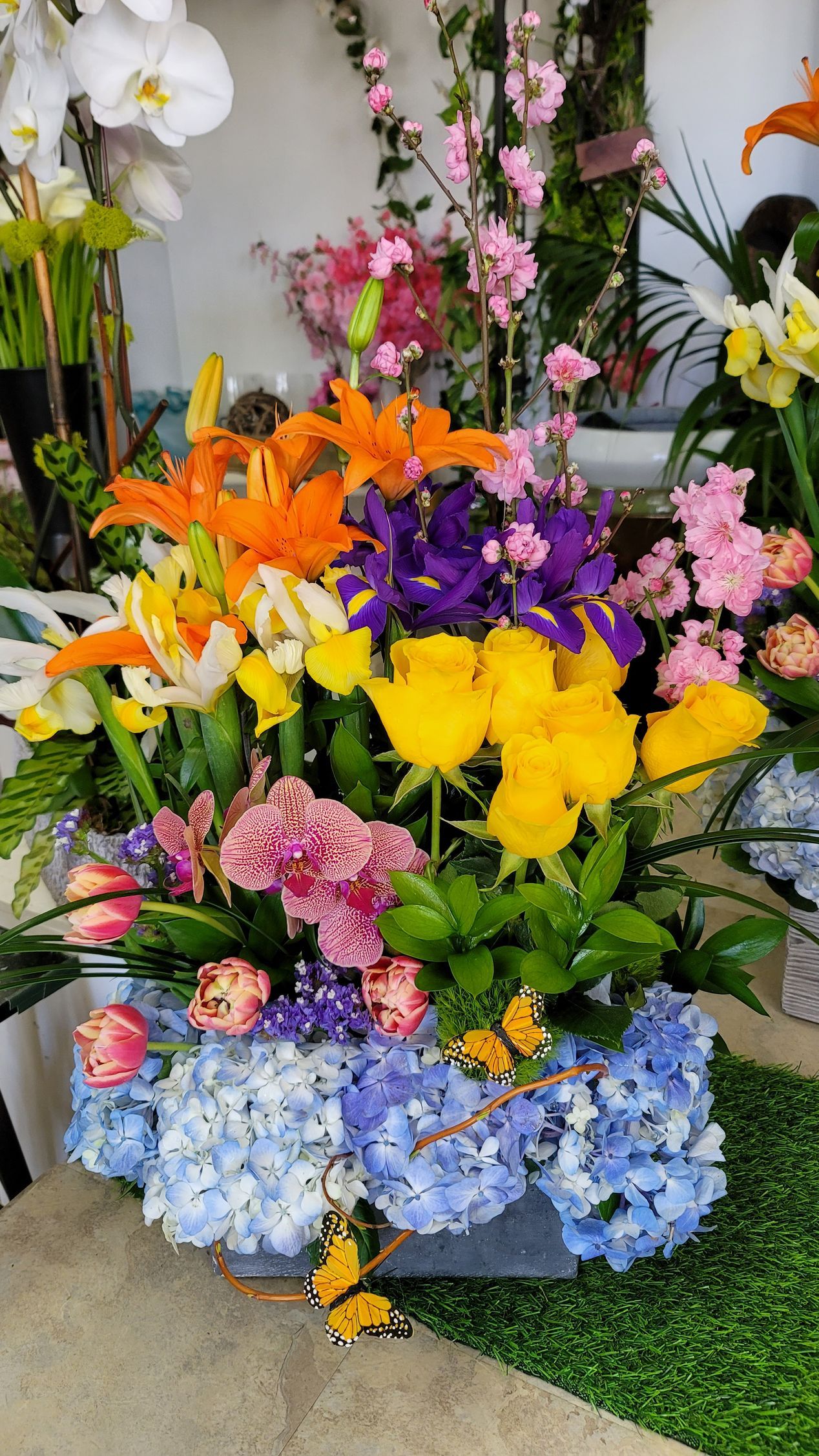 There are many different types of flowers in this bouquet.