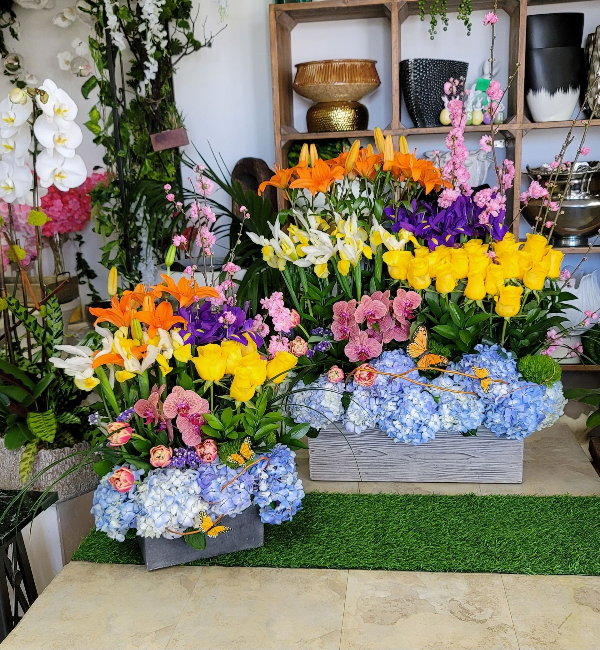 A bunch of flowers are sitting on a table in a room.
