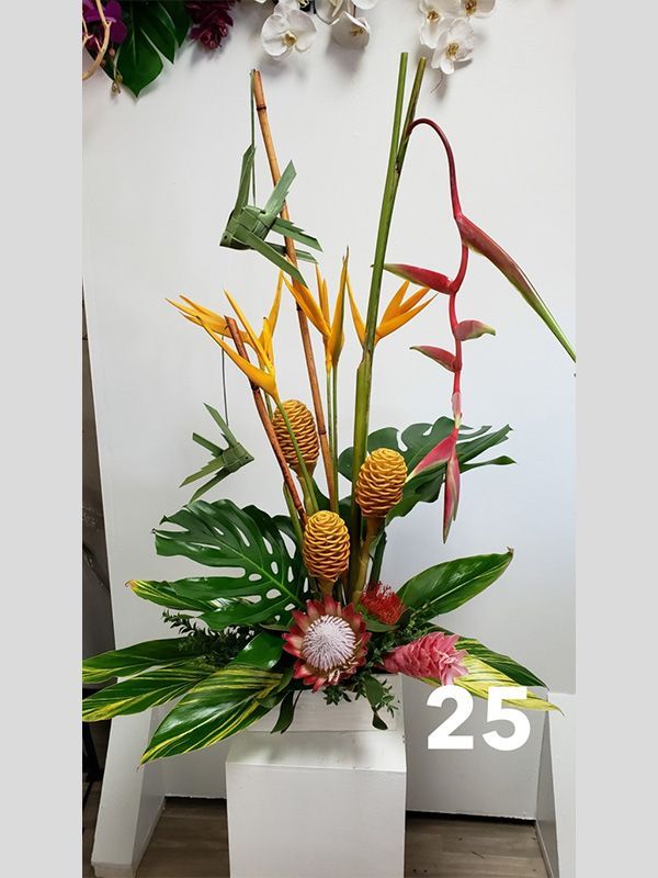 A vase of flowers with the number 25 on it