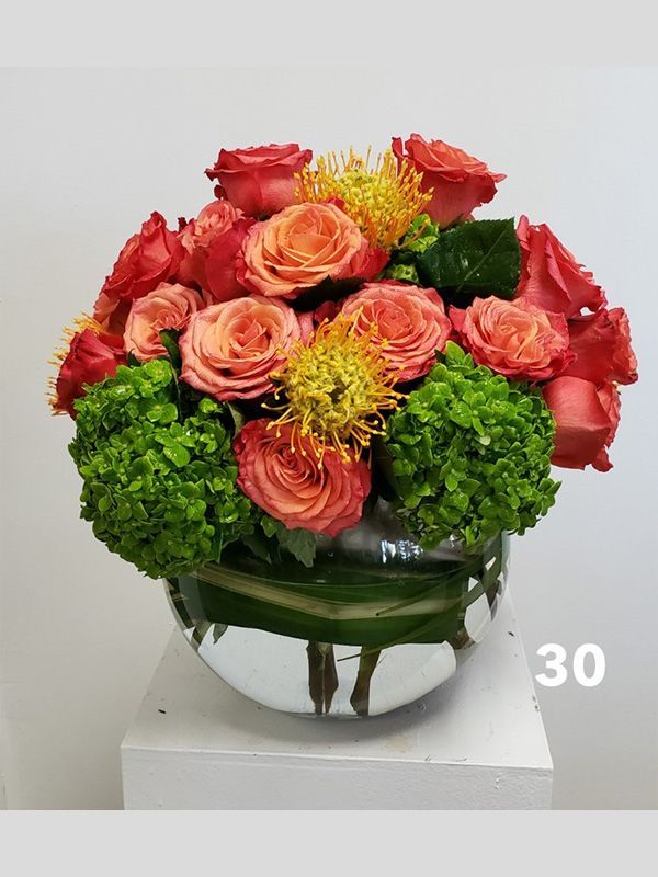 A vase filled with flowers is sitting on a table.