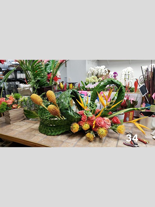 A bunch of flowers are sitting on top of a wooden table.