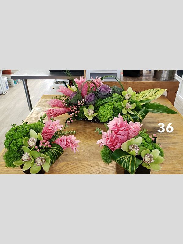 There are many different types of flowers on the table.