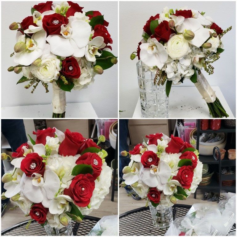 A bouquet of red and white flowers in a vase