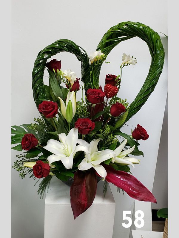 A bouquet of flowers in the shape of a heart