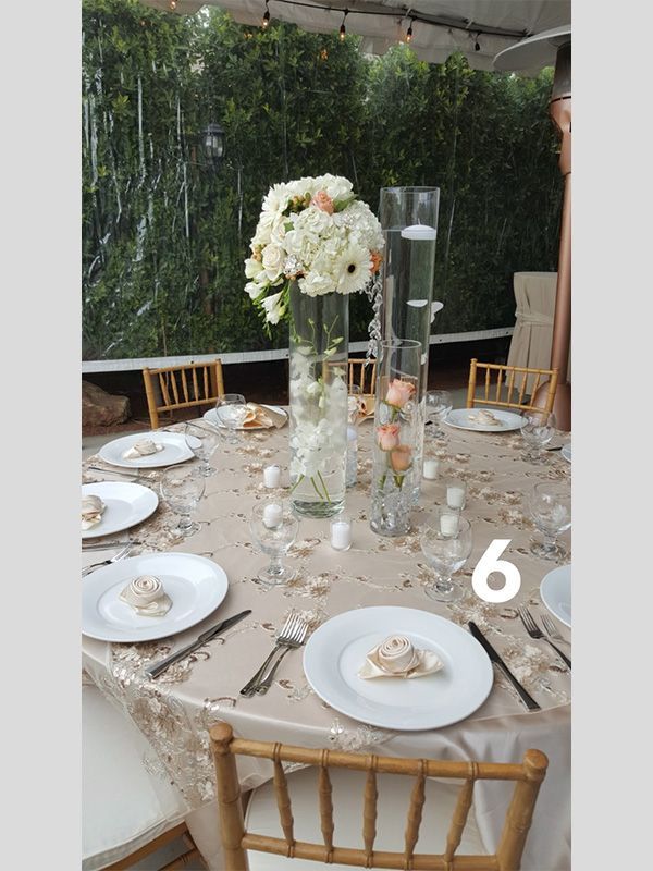 A table set for a wedding reception with the number 6 on it
