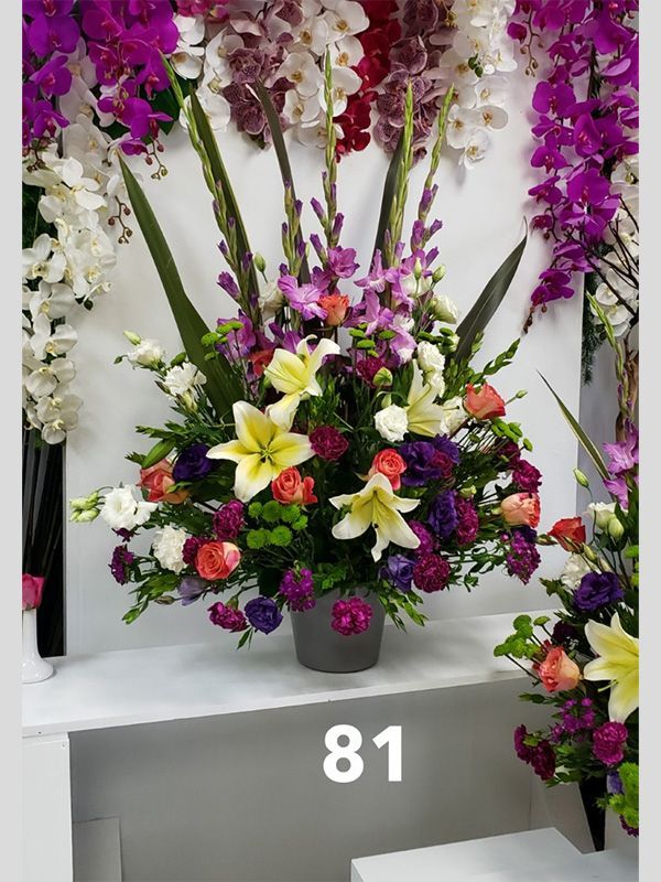 A vase of flowers with the number 81 on it