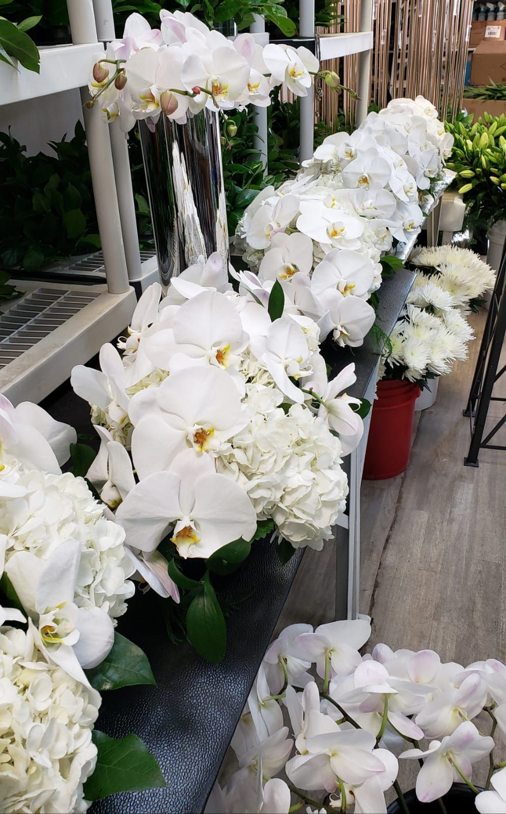 A bunch of white flowers are sitting on a table.
