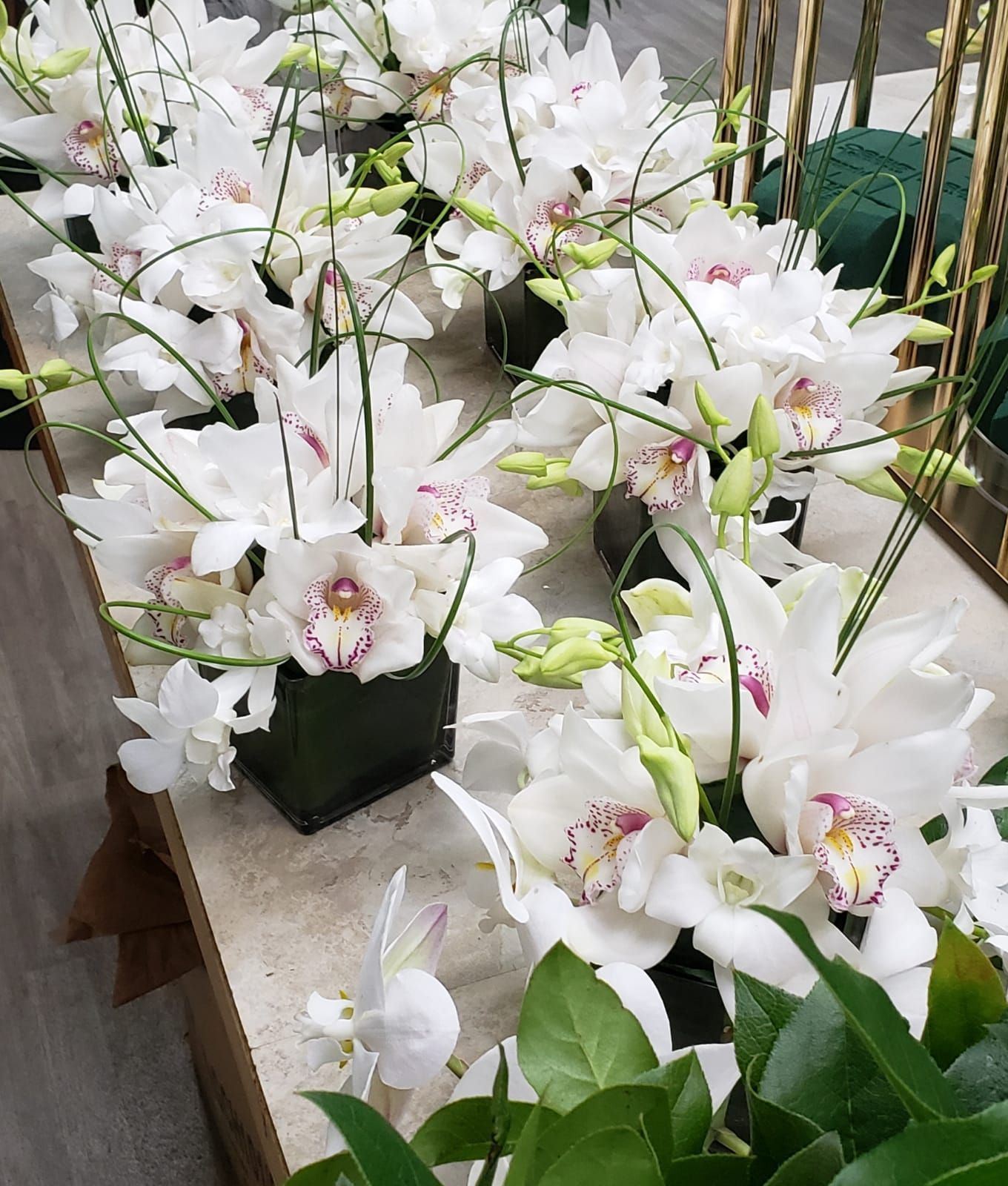A bunch of white flowers are sitting on a table.