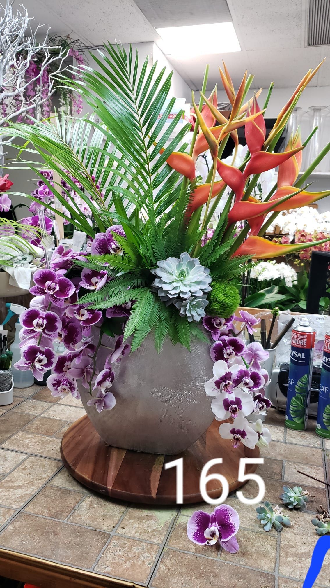 A vase filled with flowers is sitting on a table.