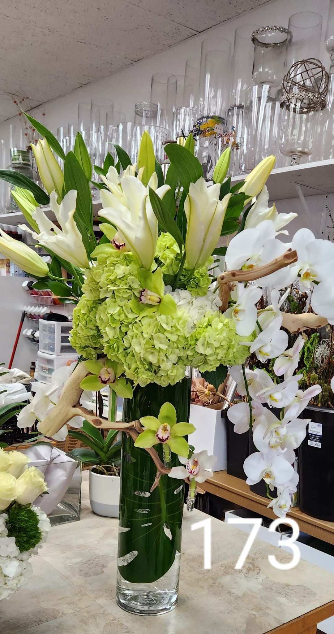 A vase filled with flowers is sitting on a table.