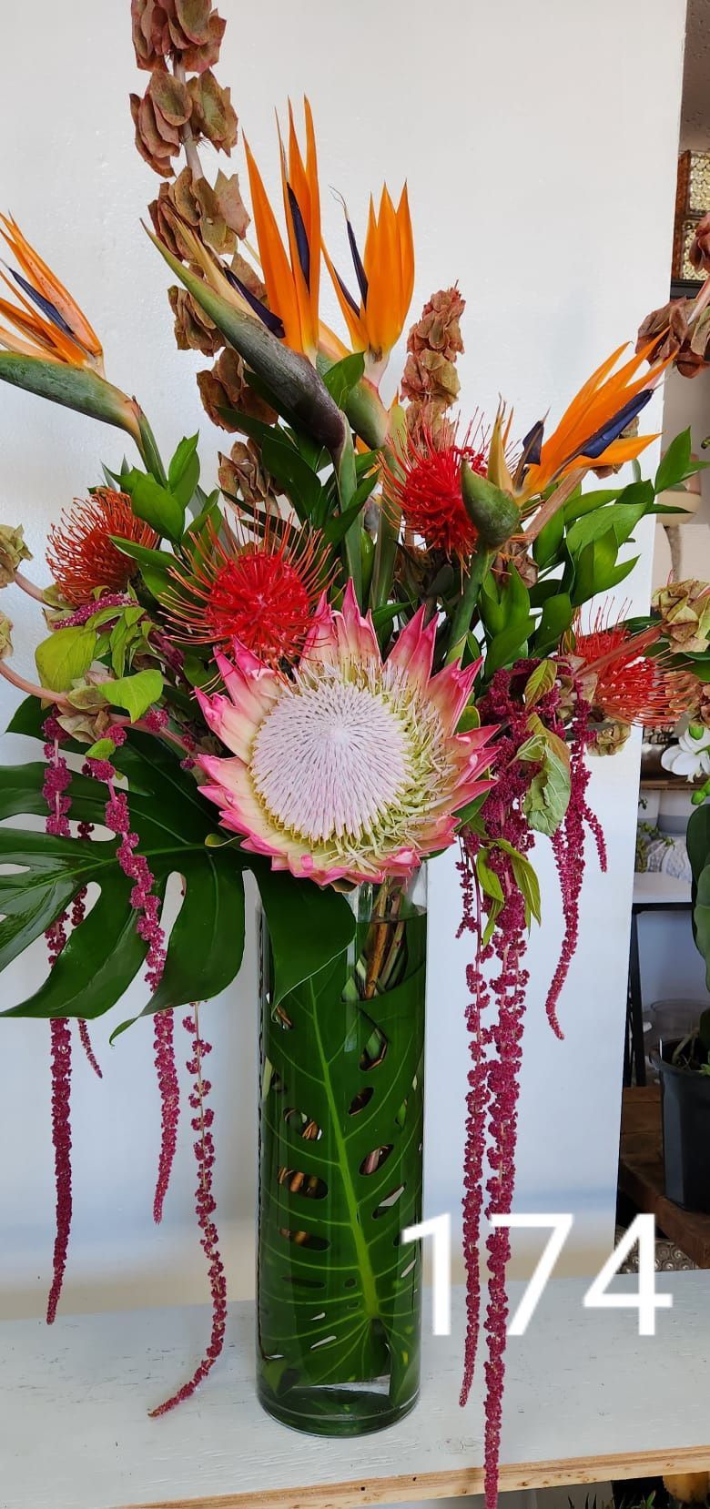 A vase filled with flowers is sitting on a table.