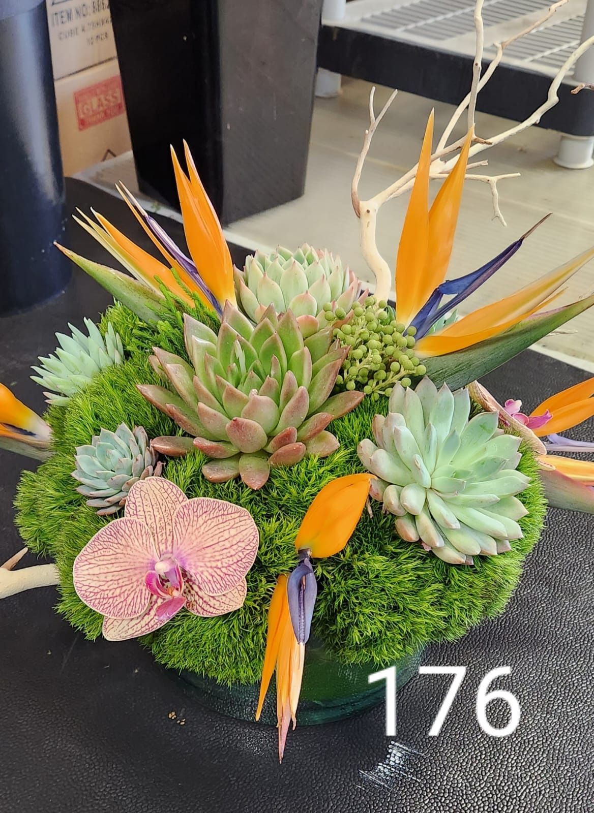 A bouquet of flowers with the number 176 on the bottom