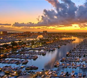 An aerial view of a marina at sunset