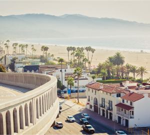An aerial view of a city with a beach in the background