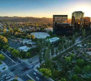 An aerial view of a city with lots of trees and buildings