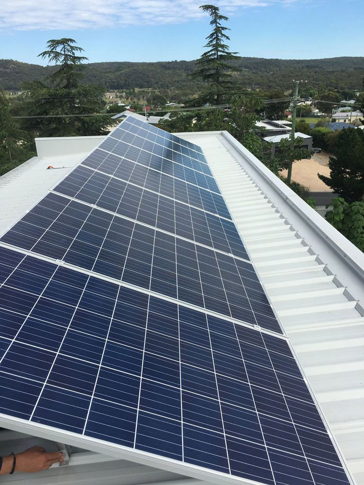 Solar Panels Installed on The Roof of A Building — Solar Blessing in Warwick, QLD