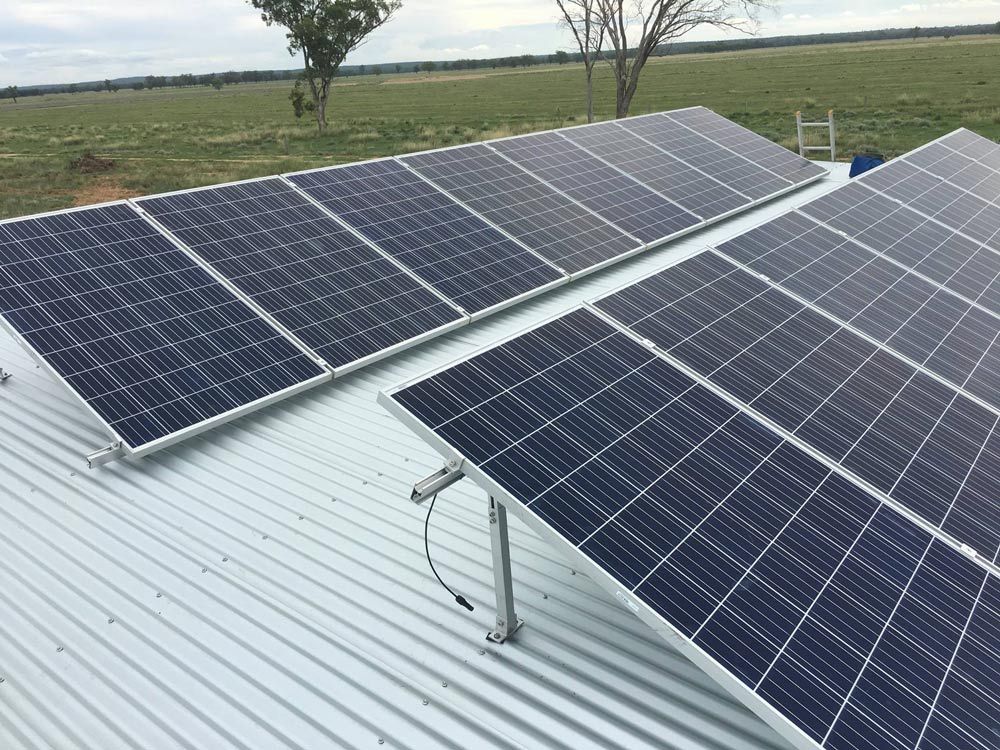 A Row of Solar Panels Are Installed  on Top of A Metal Roof — Solar Blessing in Stanthorpe, QLD