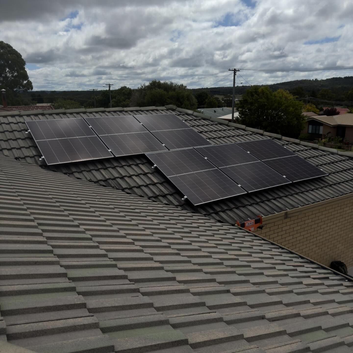 Roof With Solar Panels Installed In A Cloudy Day — Solar Blessing in Stanthorpe, QLD
