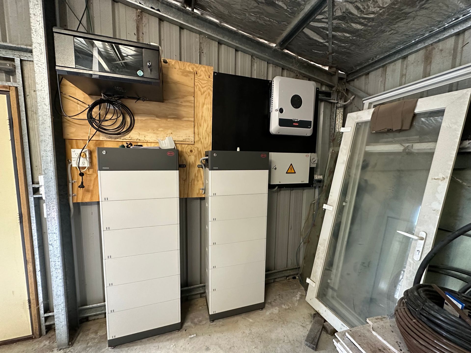 A Solar Panel Is Connected to A Battery And Inverter Circuit in A Room — Solar Blessing in Stanthorpe, QLD