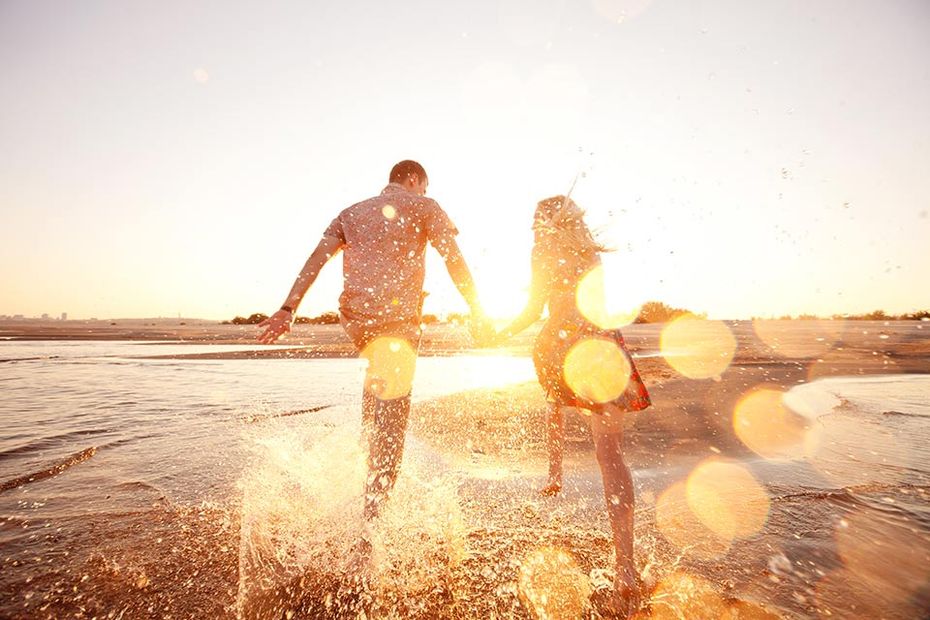 couple running on beach