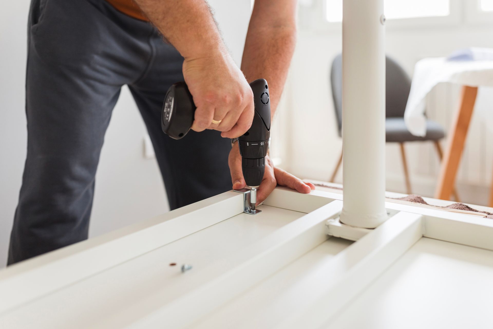 A living room filled with cardboard boxes and a guitar.