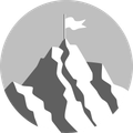 A mountain with a flag on top of it.