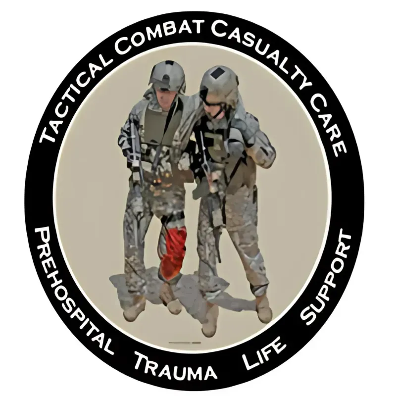Logo: Soldiers assisting wounded comrade; text 