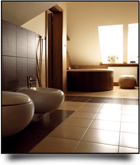 Modern bathroom with brown and cream tiles, brown corner bath, and bidet