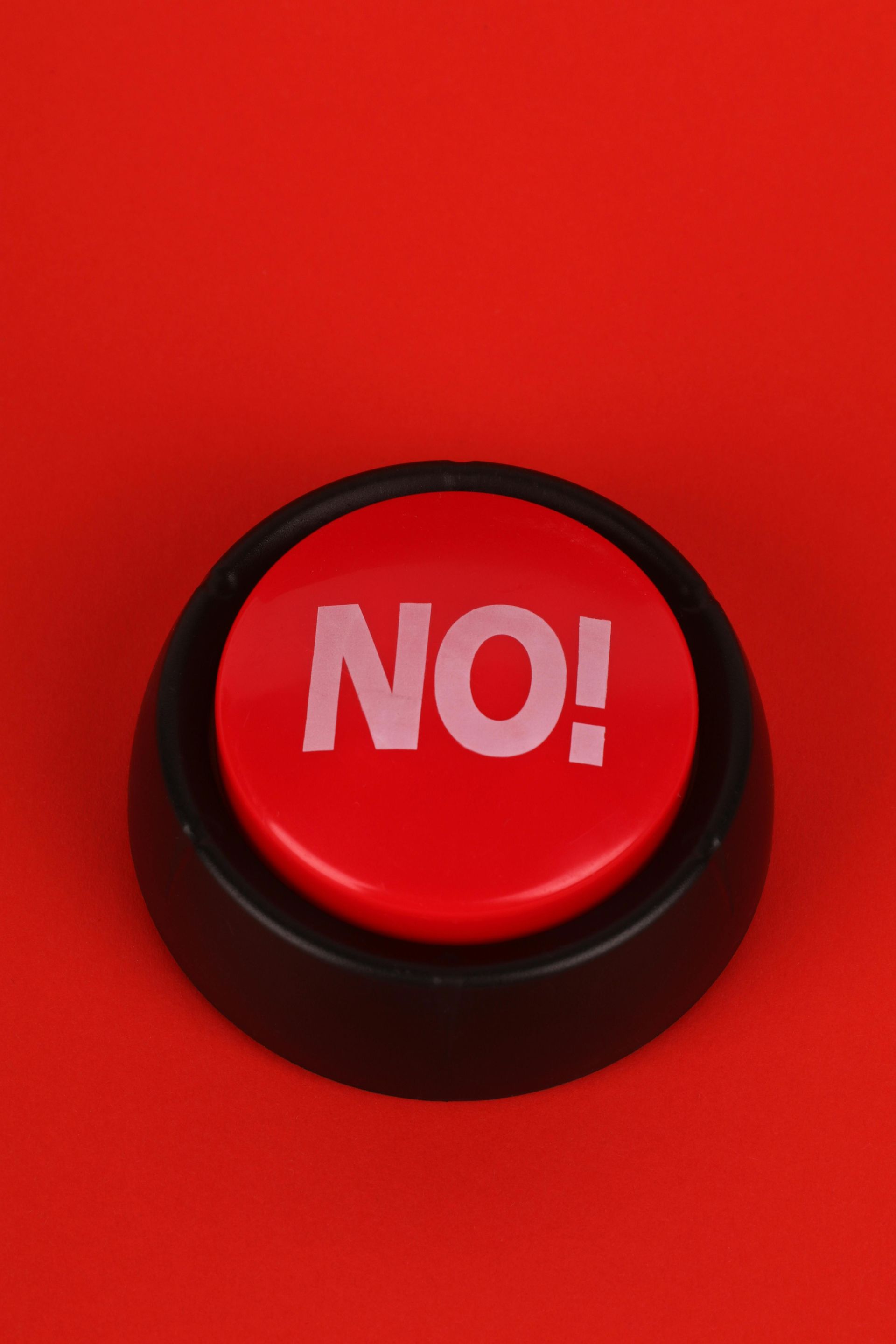 A red button with the word no on it