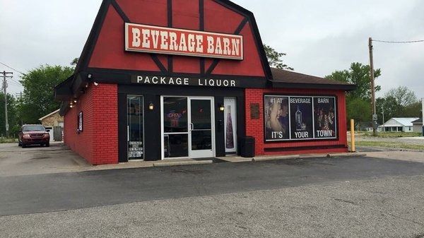 A red building with a sign that says beverage barn package liquor