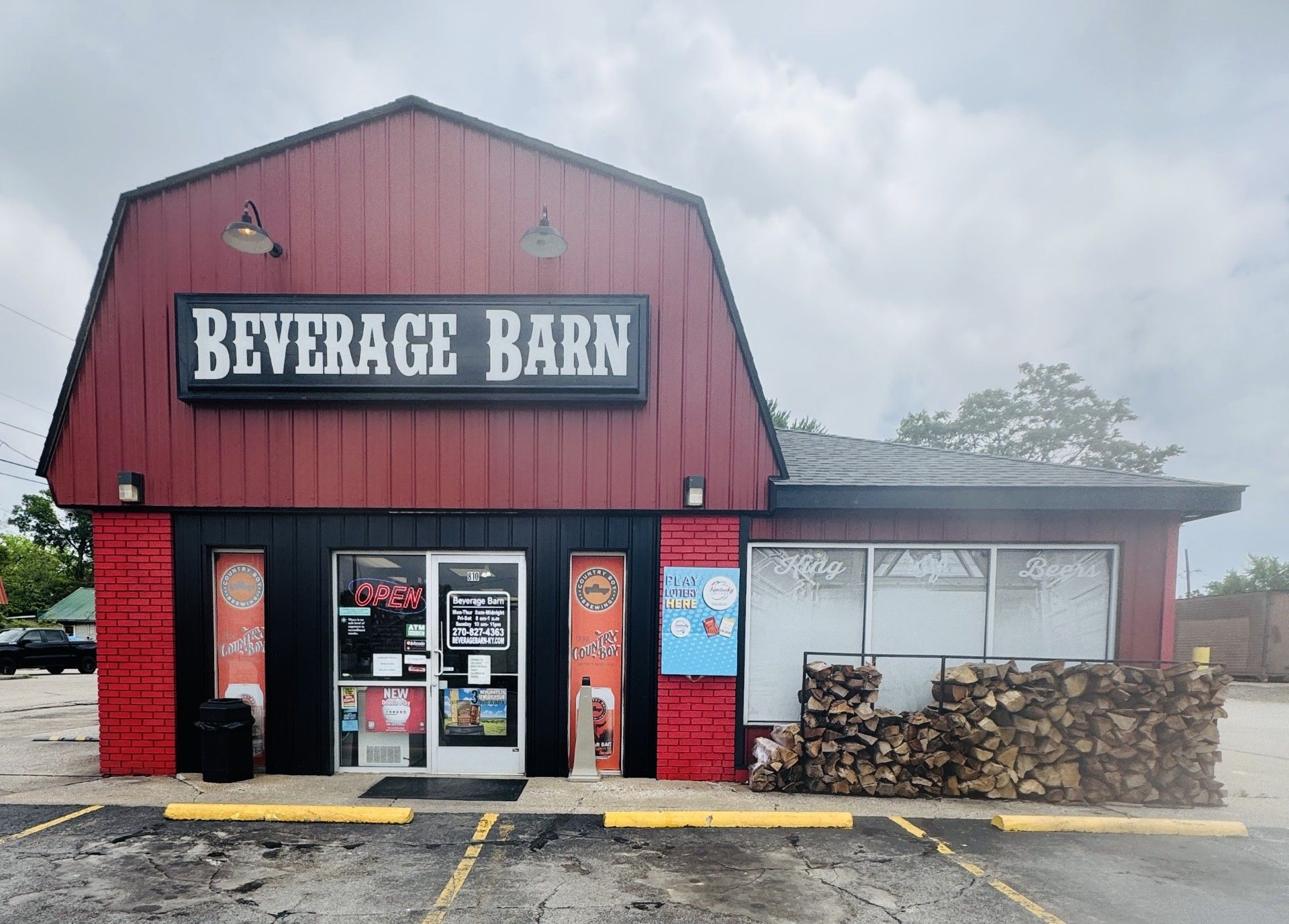 A red building with a sign that says beverage barn package liquor