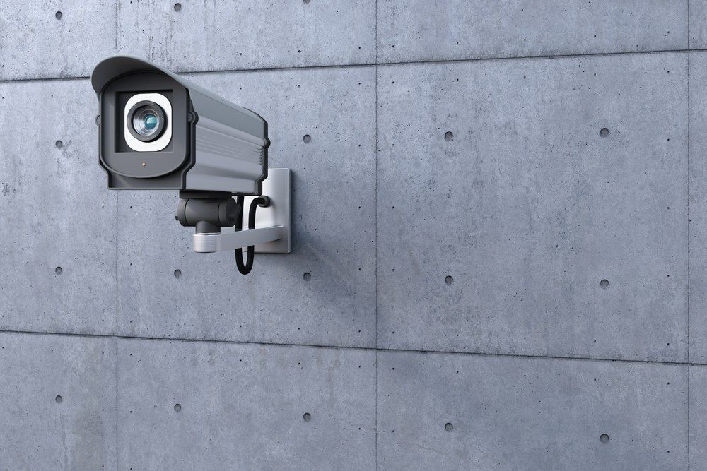 Security Camera Mounted on a Gray Concrete Wall — X-Mod Security In Landsborough, QLD