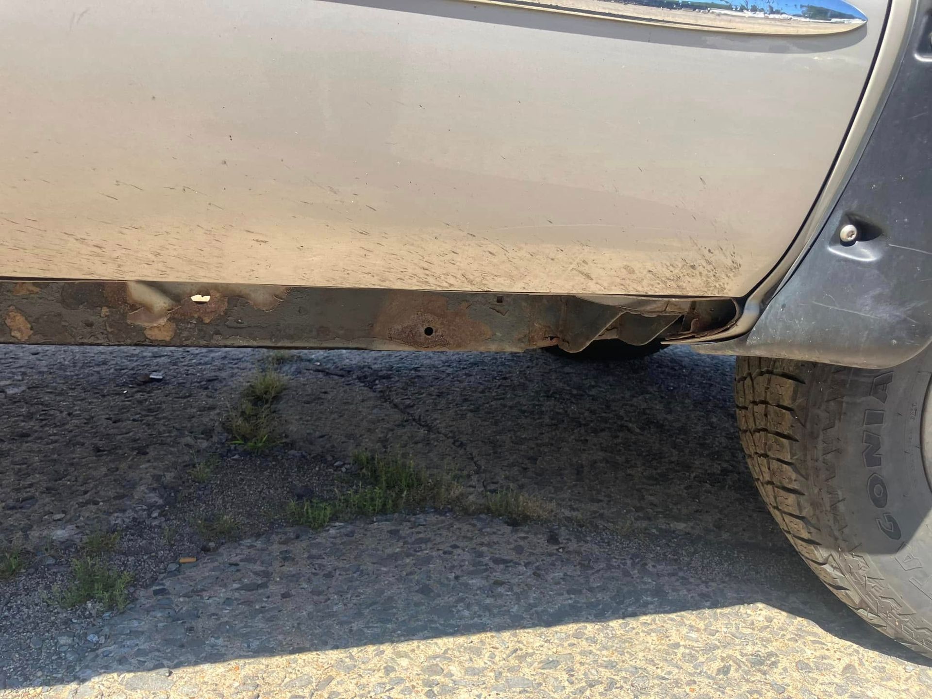 A car is parked on the side of the road.