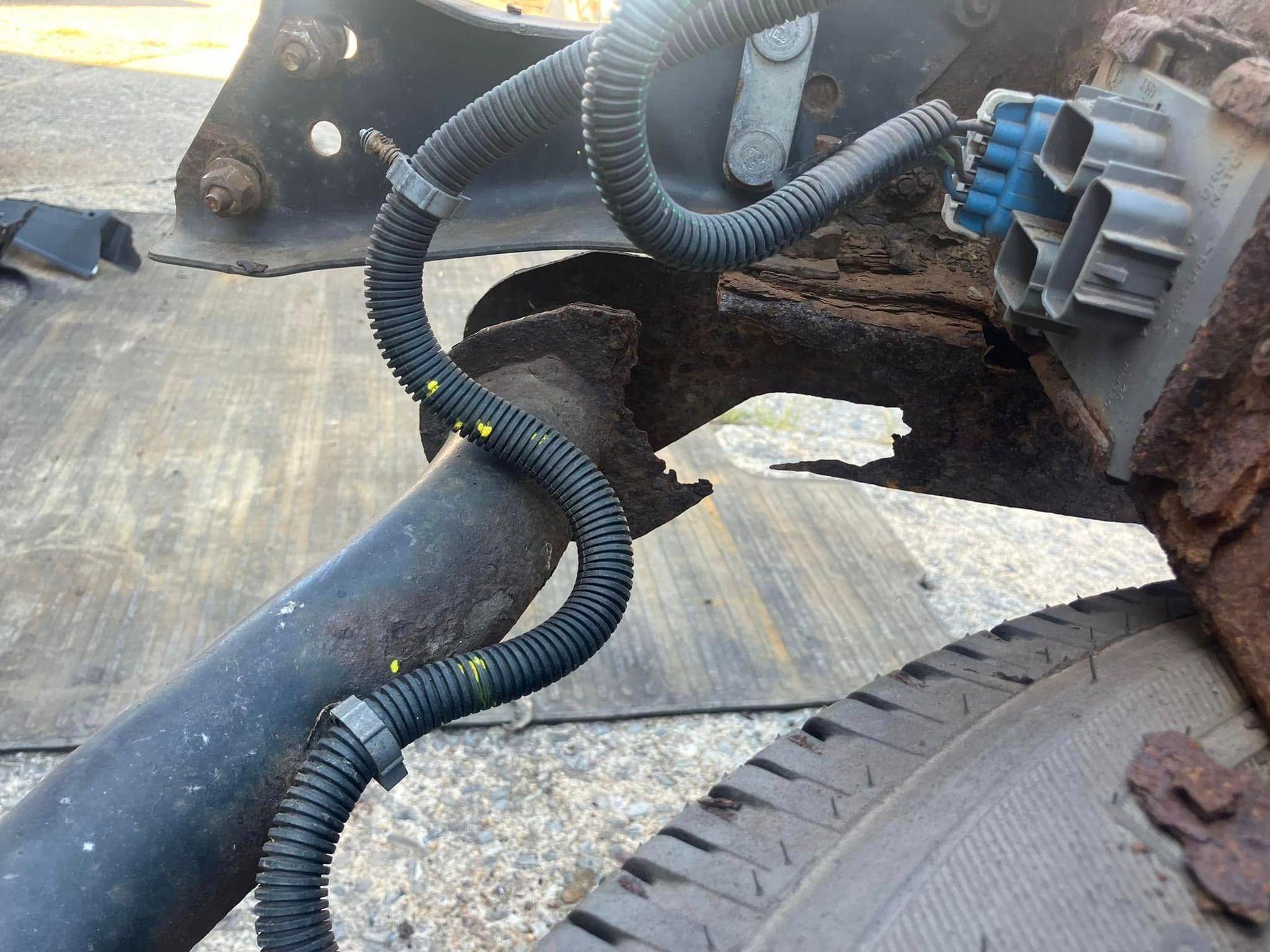 A close up of a hose on the side of a car