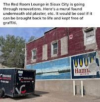 Exterior of the Red Room Lounge in Sioux City, showing a mural with Hamm's Beer sign.