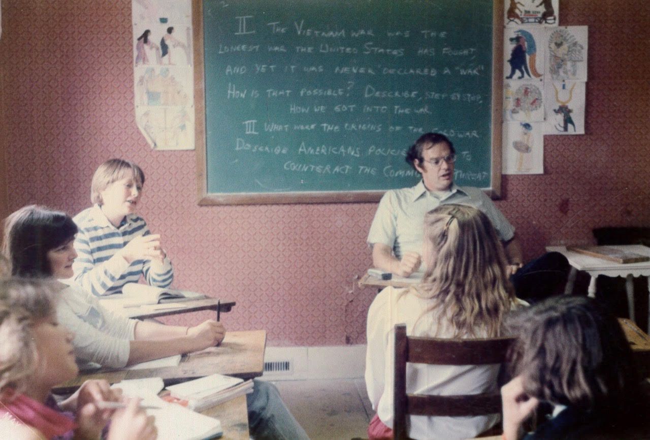 Old photo of teacher teaching a class at the Riverside School