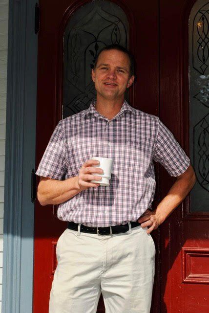 Roy Starling Standing in front of a red door smiling