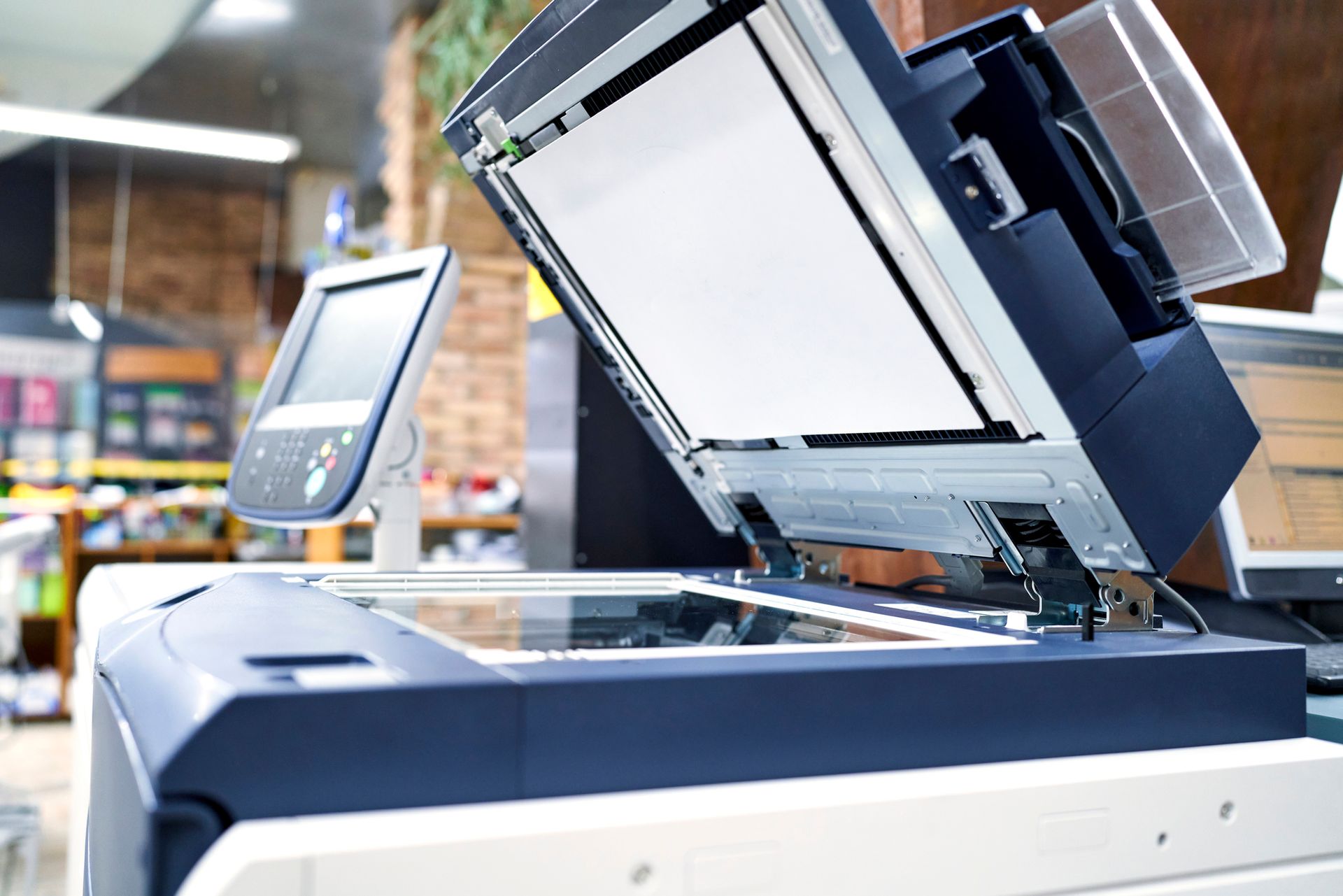 Office workspace featuring a modern photocopier printer, perfect for copier repair service.