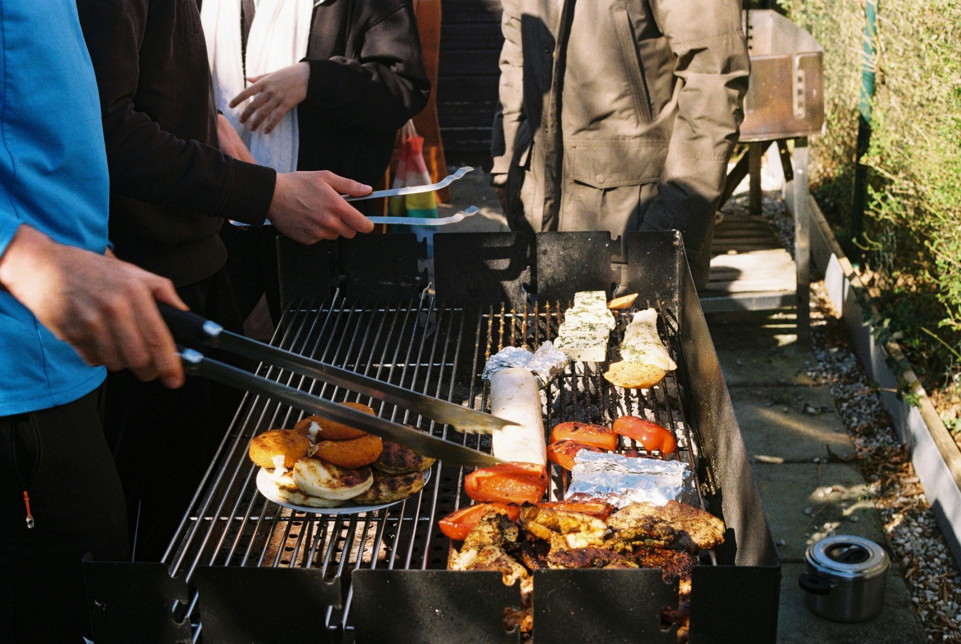 A man cooking meat on the bbq.