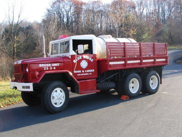 A red truck with the word blue ridge on the side
