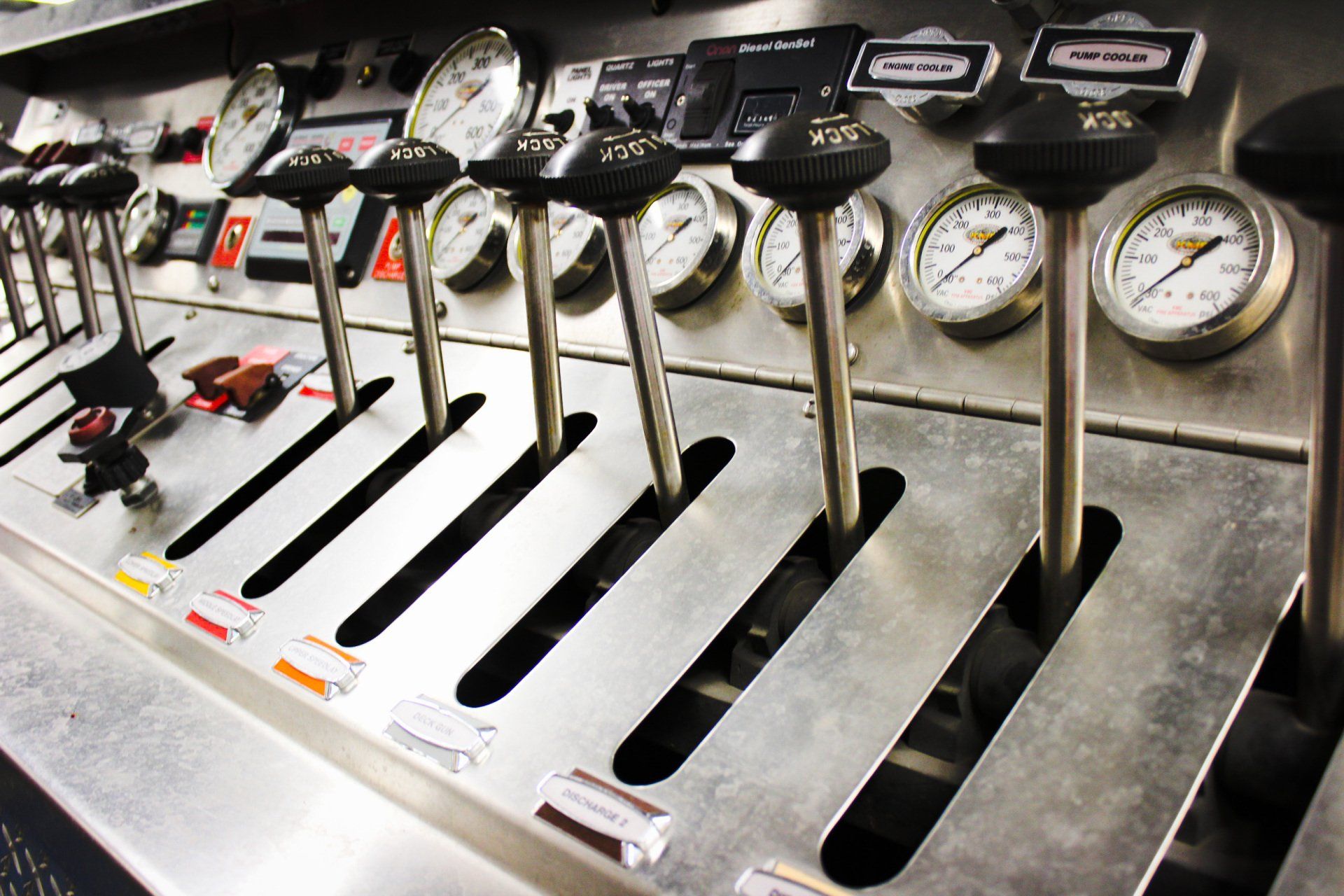 A control panel with a bunch of gauges and buttons