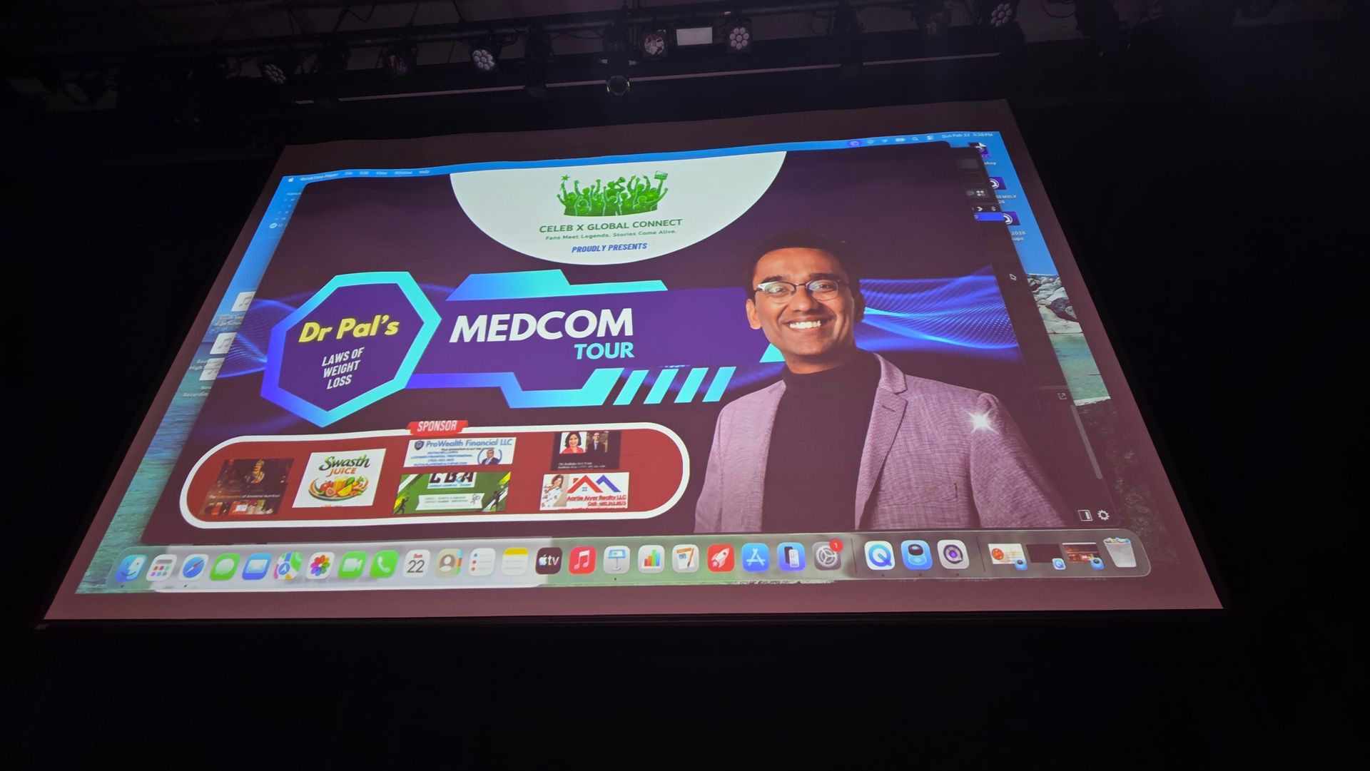 Laptop screen showing a MEDCOM slide with a portrait and colorful presentation graphics.