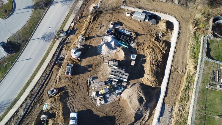 An aerial view of a construction site with a lot of dirt and machinery.