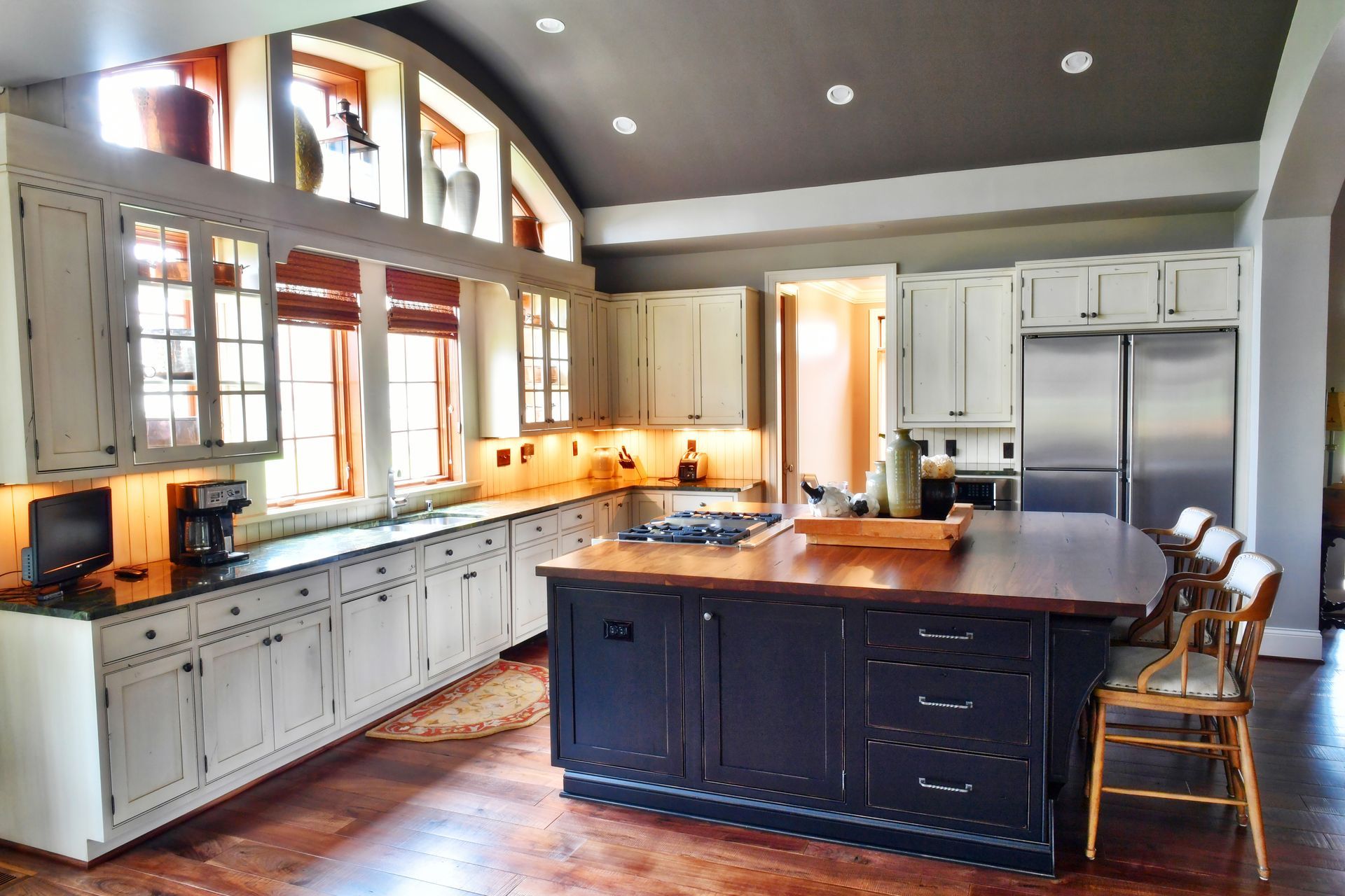 A large kitchen with a large island in the middle