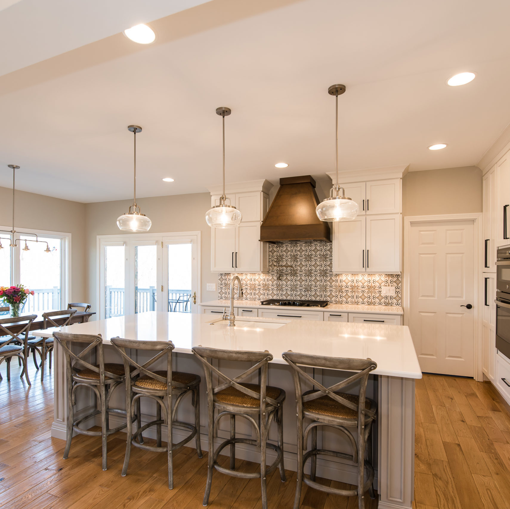 There is a large island in the middle of the kitchen installed by Reston Construction.